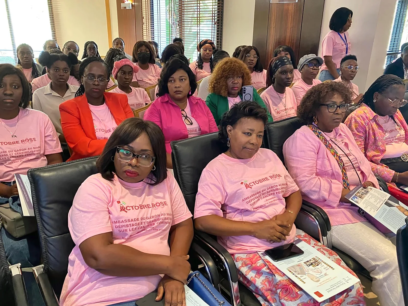 Audience at the Pink October day, wearing the campaign’s pink T-shirts